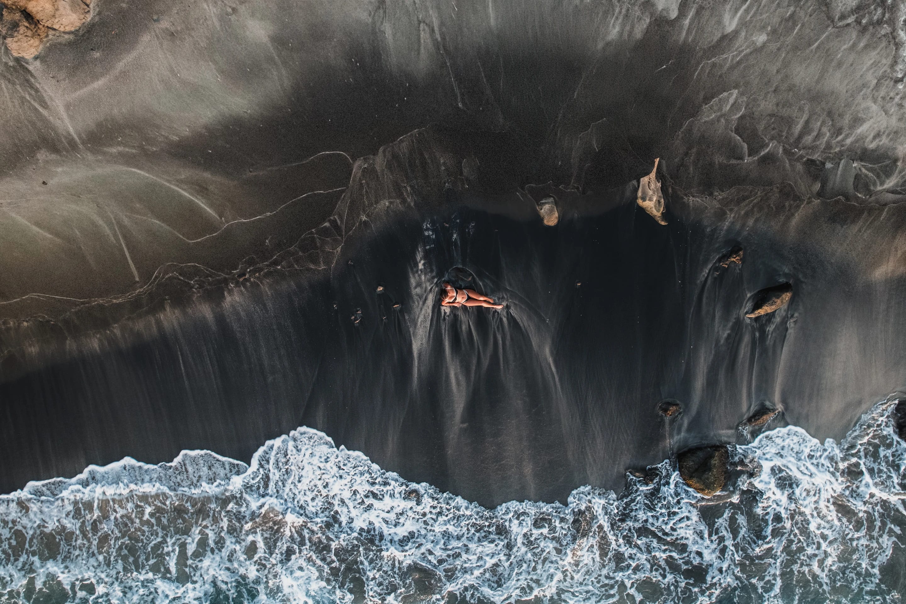Aerial of a dark volcanic coastline
